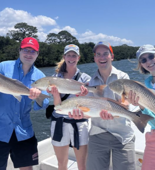 Redfish galore with Captain Lucas in Holmes Beach